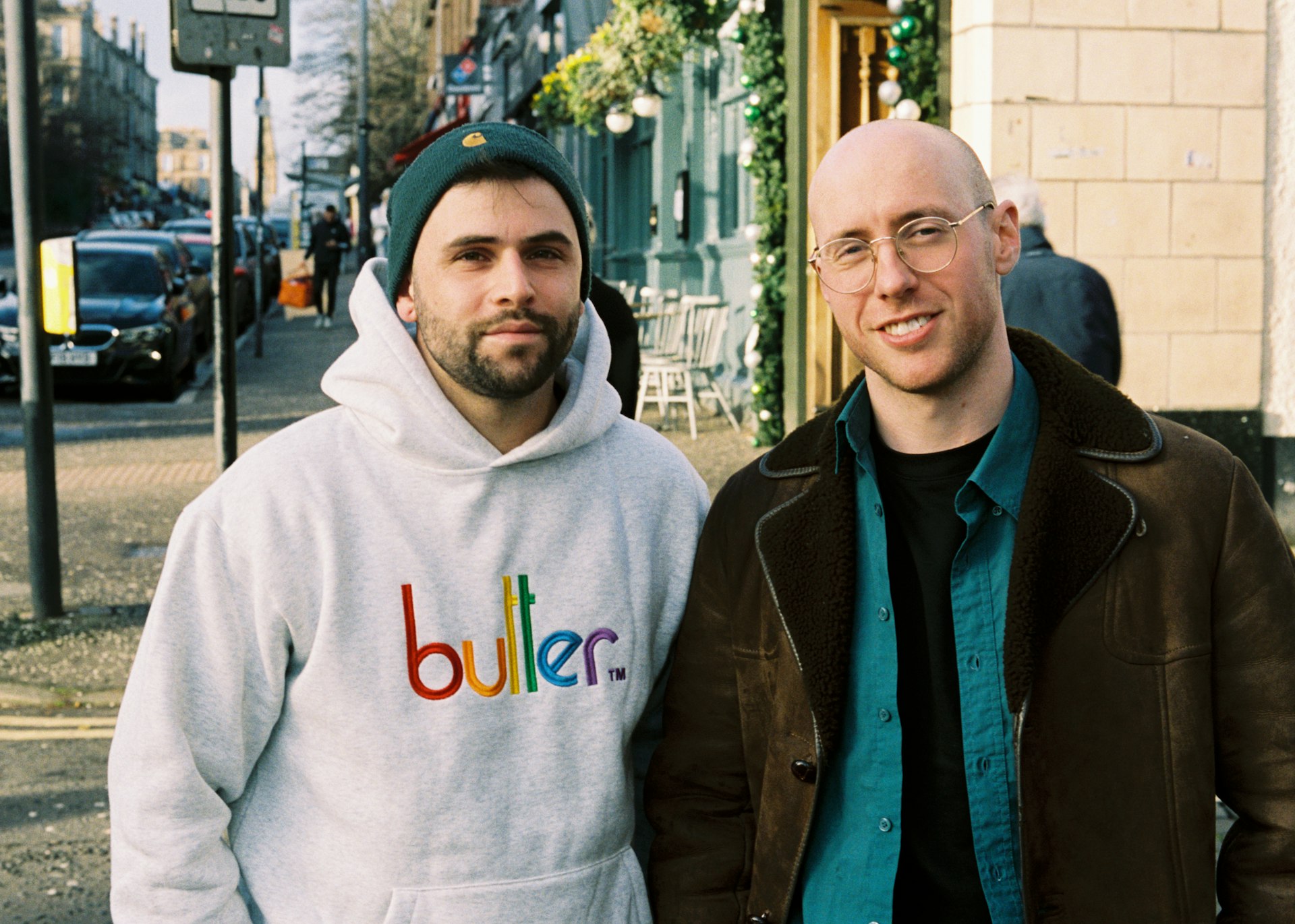 Two man standing on the sidewalk