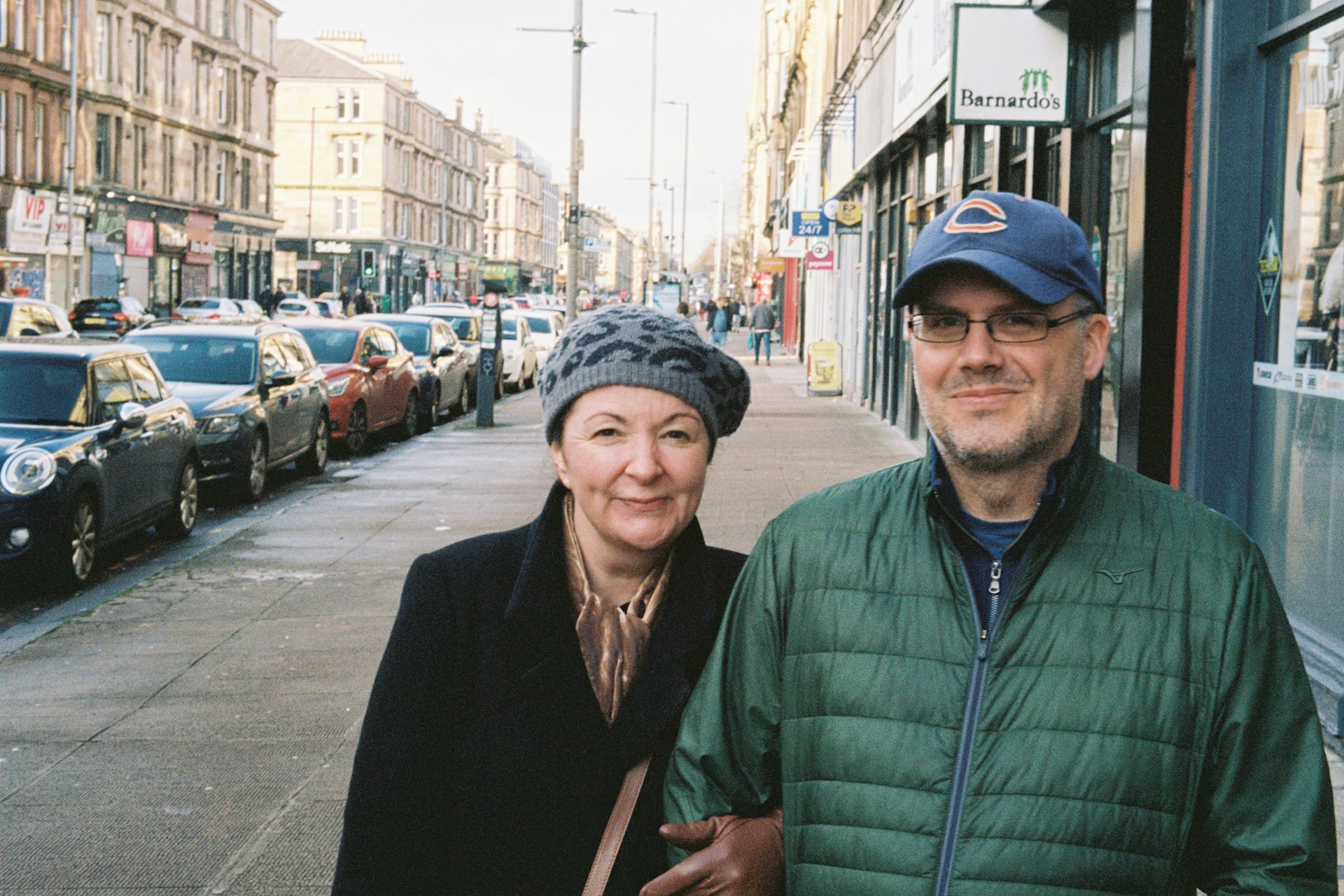 A couple standing on the sidewalk
