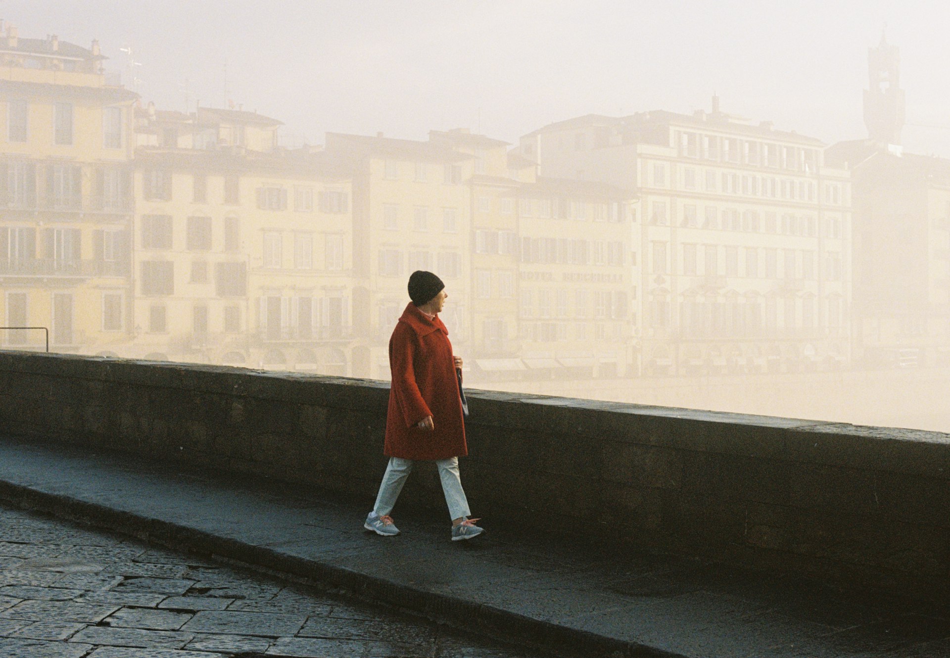 A woman walking through mist