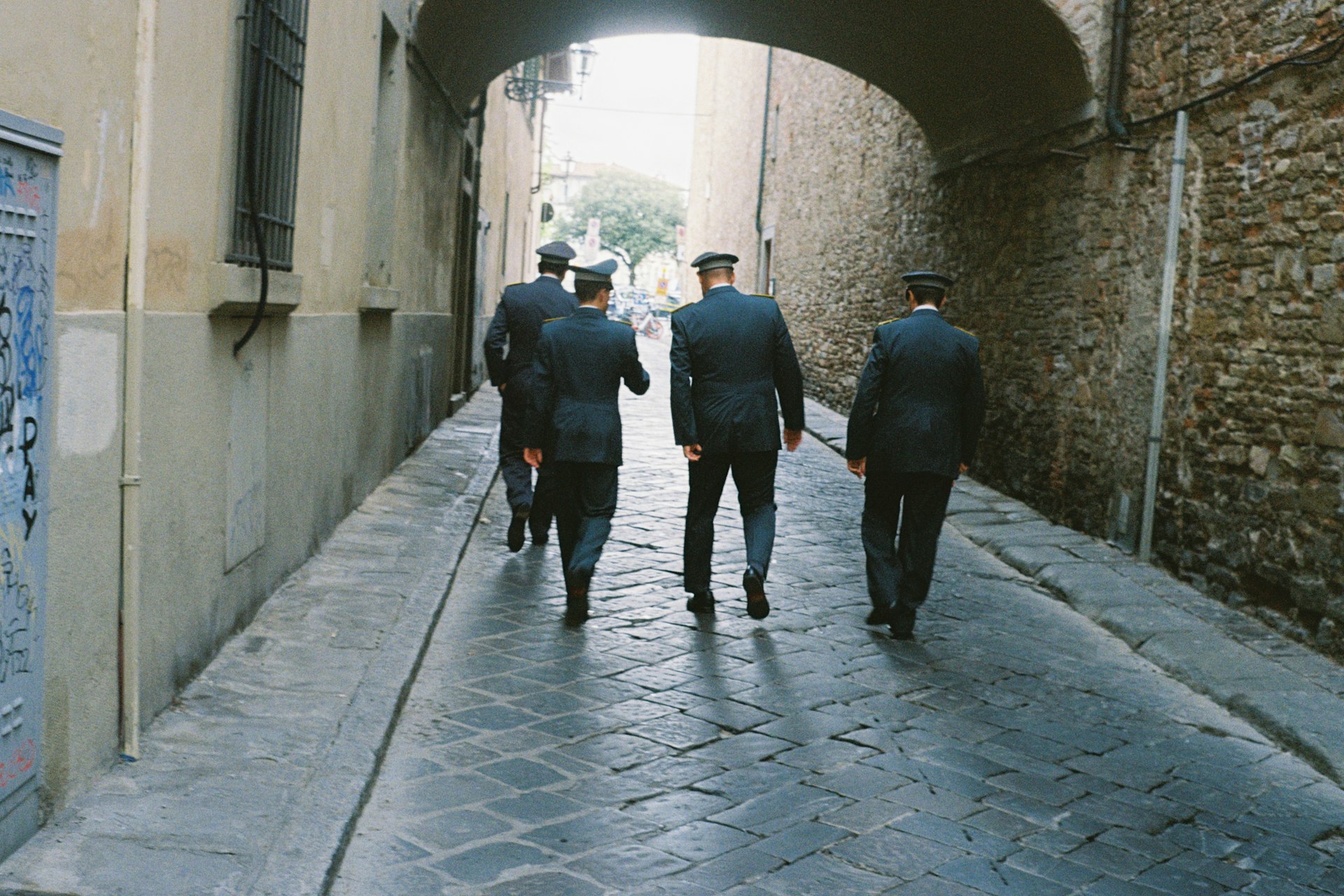 Soldiers walking down an alley