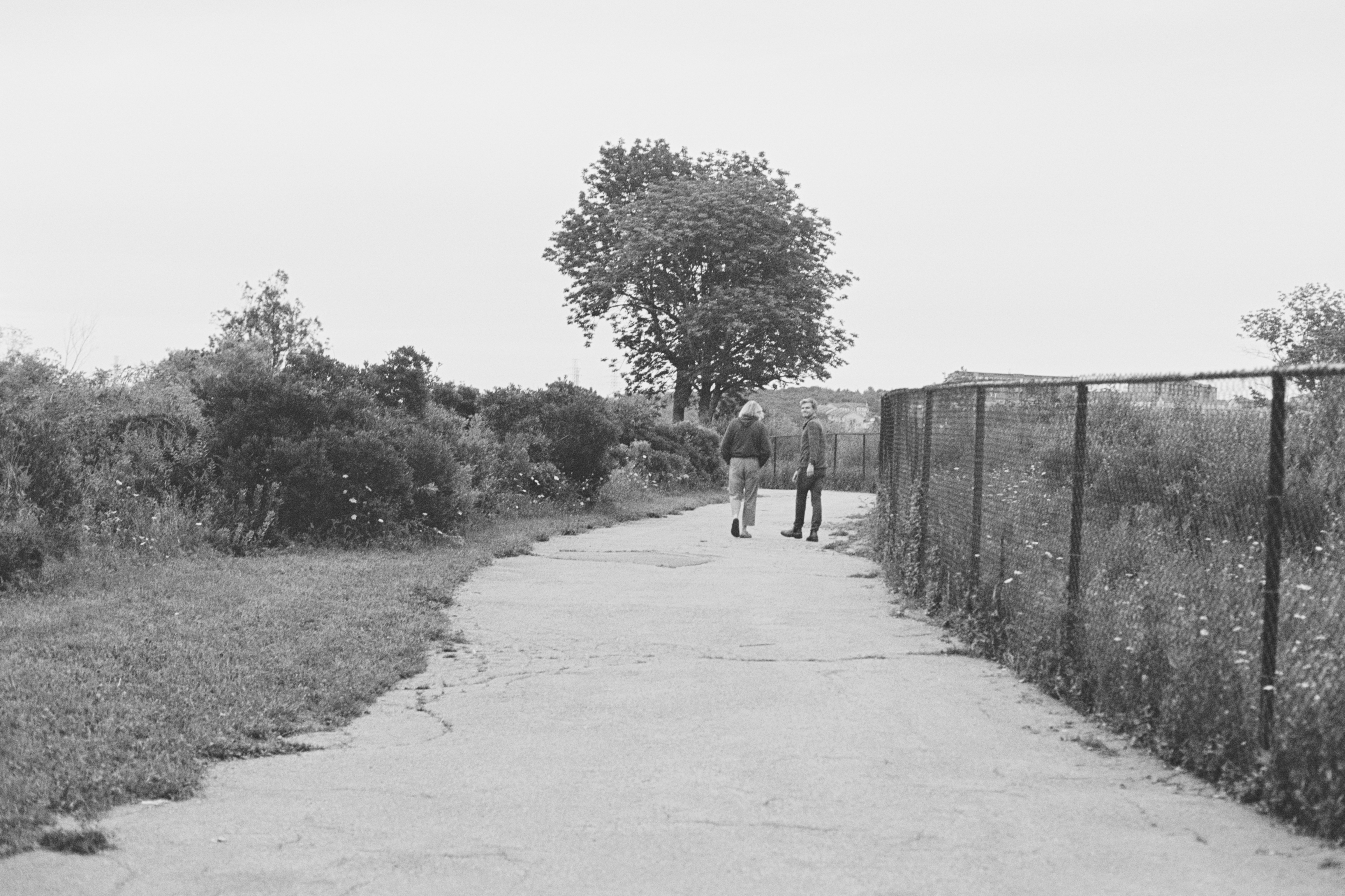 Ali and Ken walking down a path