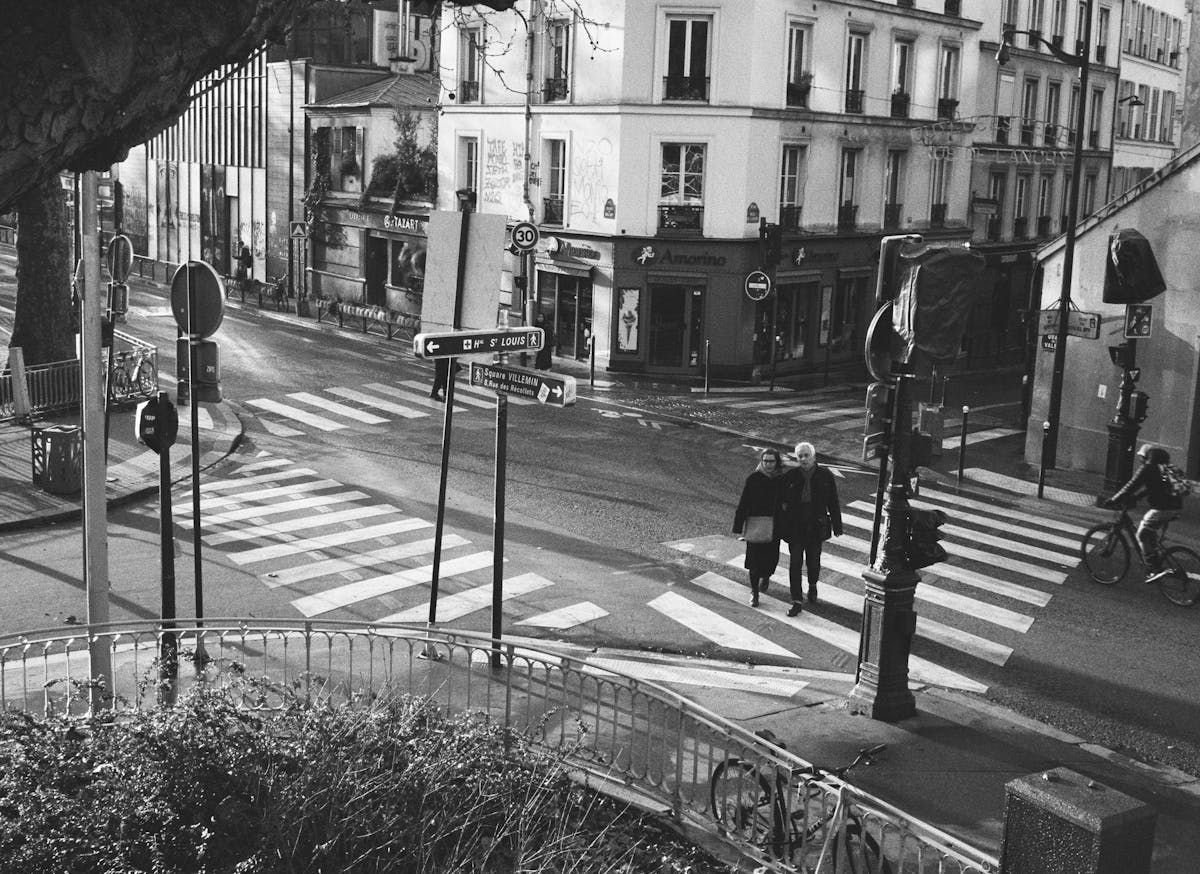 A couple crossing the street in Paris