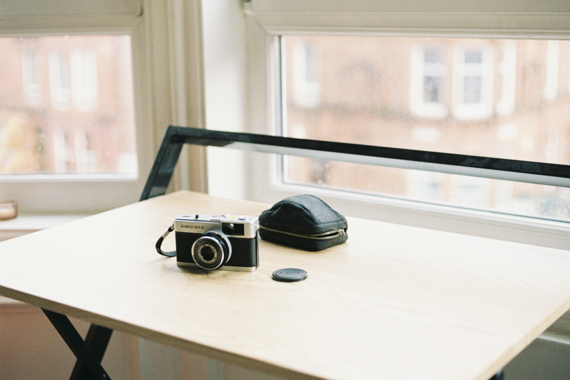 A 35mm compact camera sitting on a table