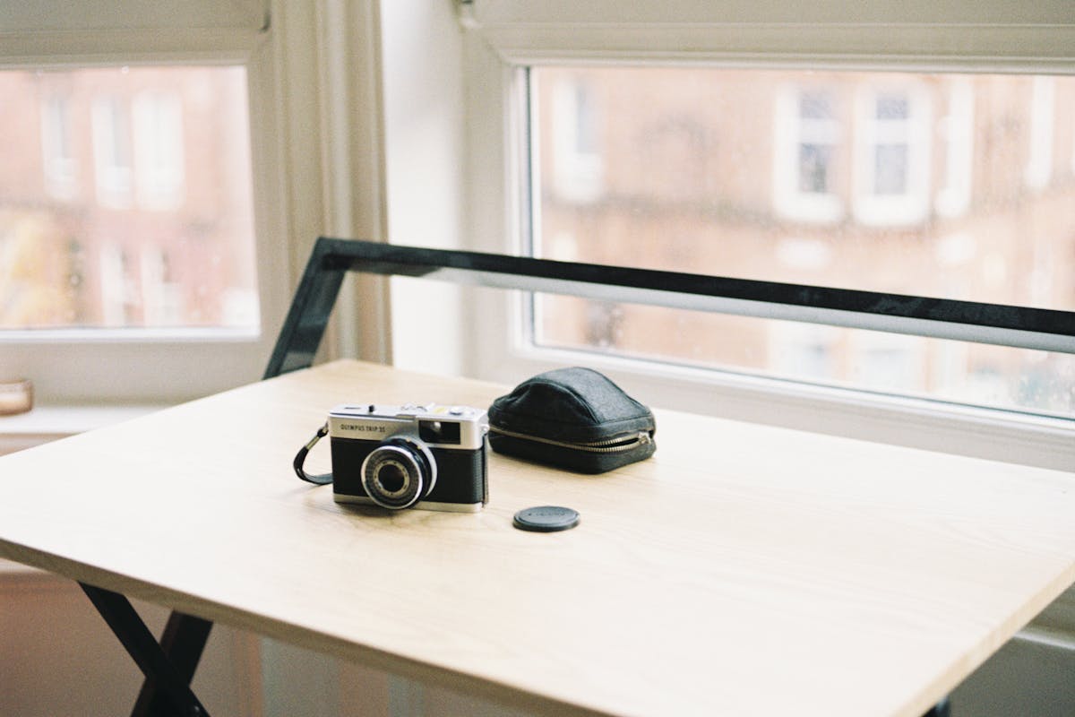A 35mm compact camera sitting on a table