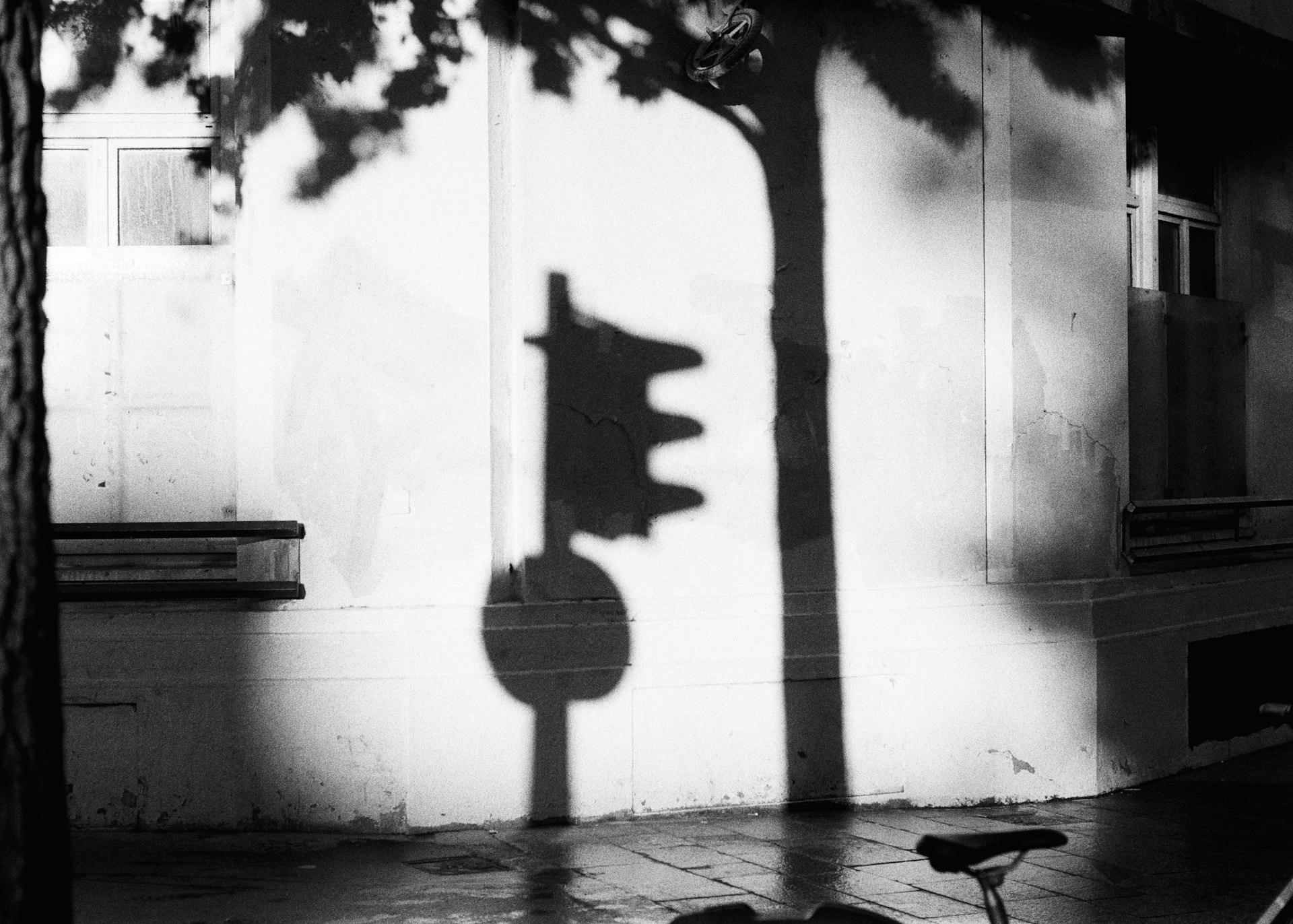 the shadow of a traffic light on a wall