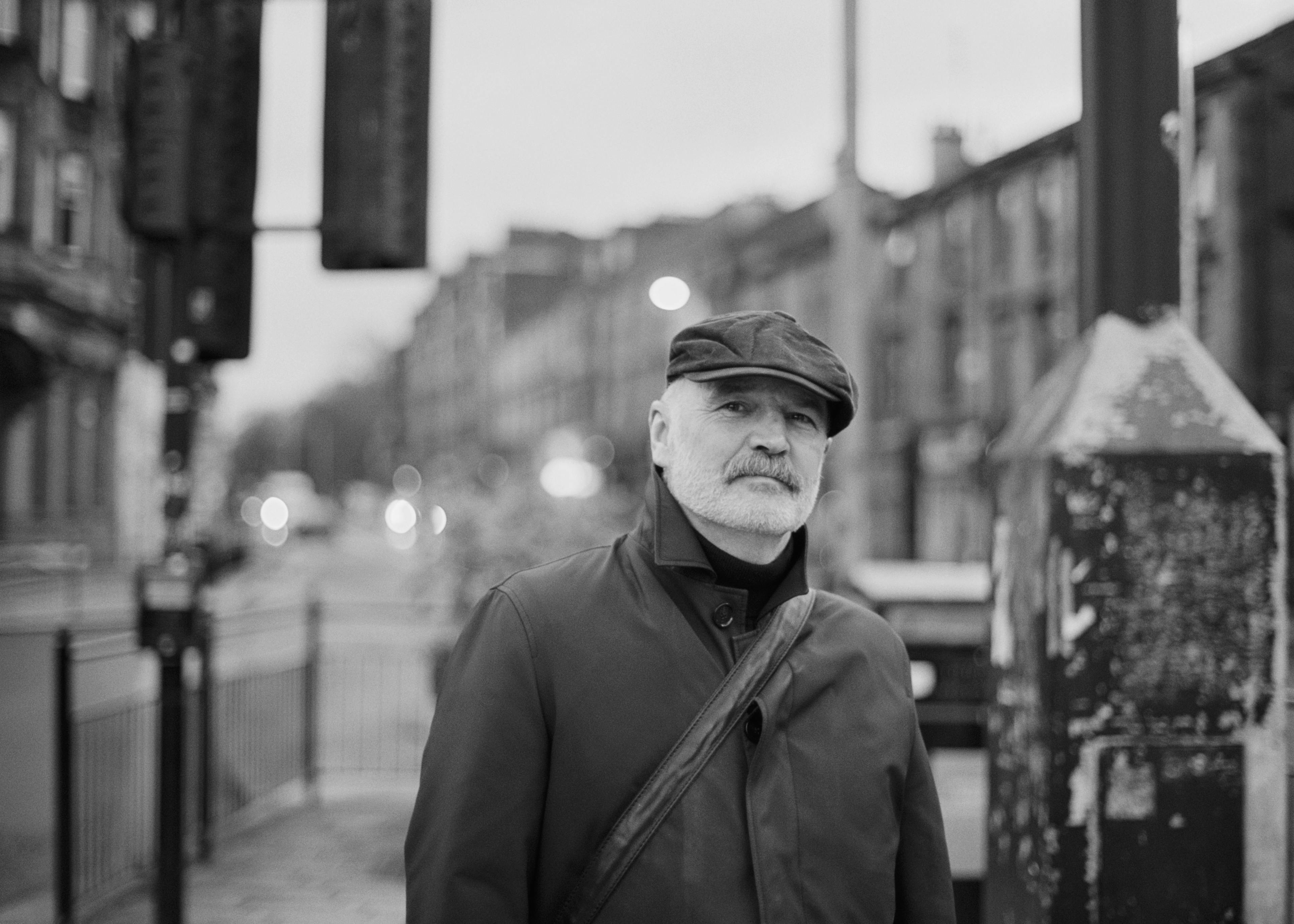 A man standing on the sidewalk