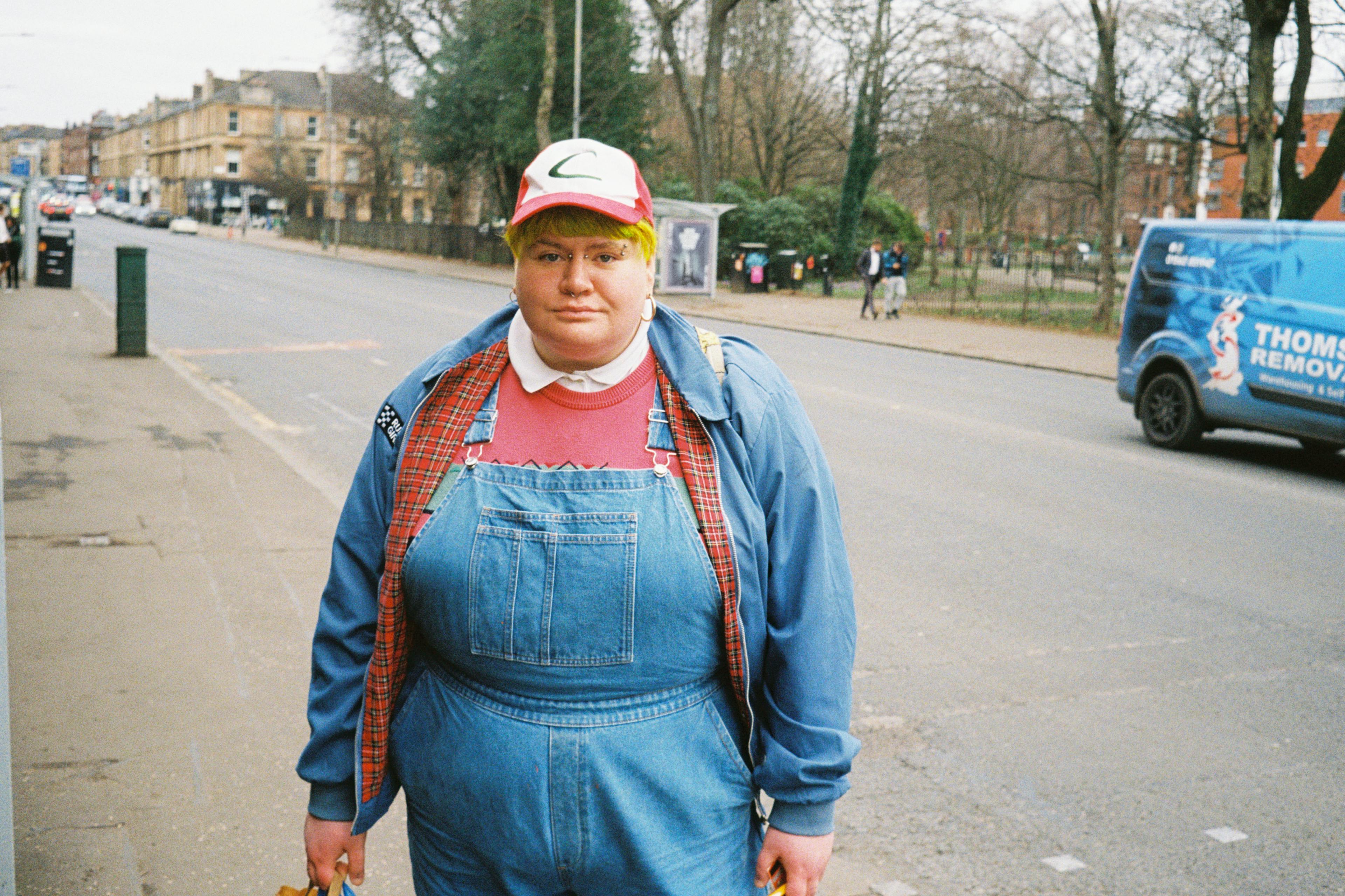 A woman standing on the sidewalk