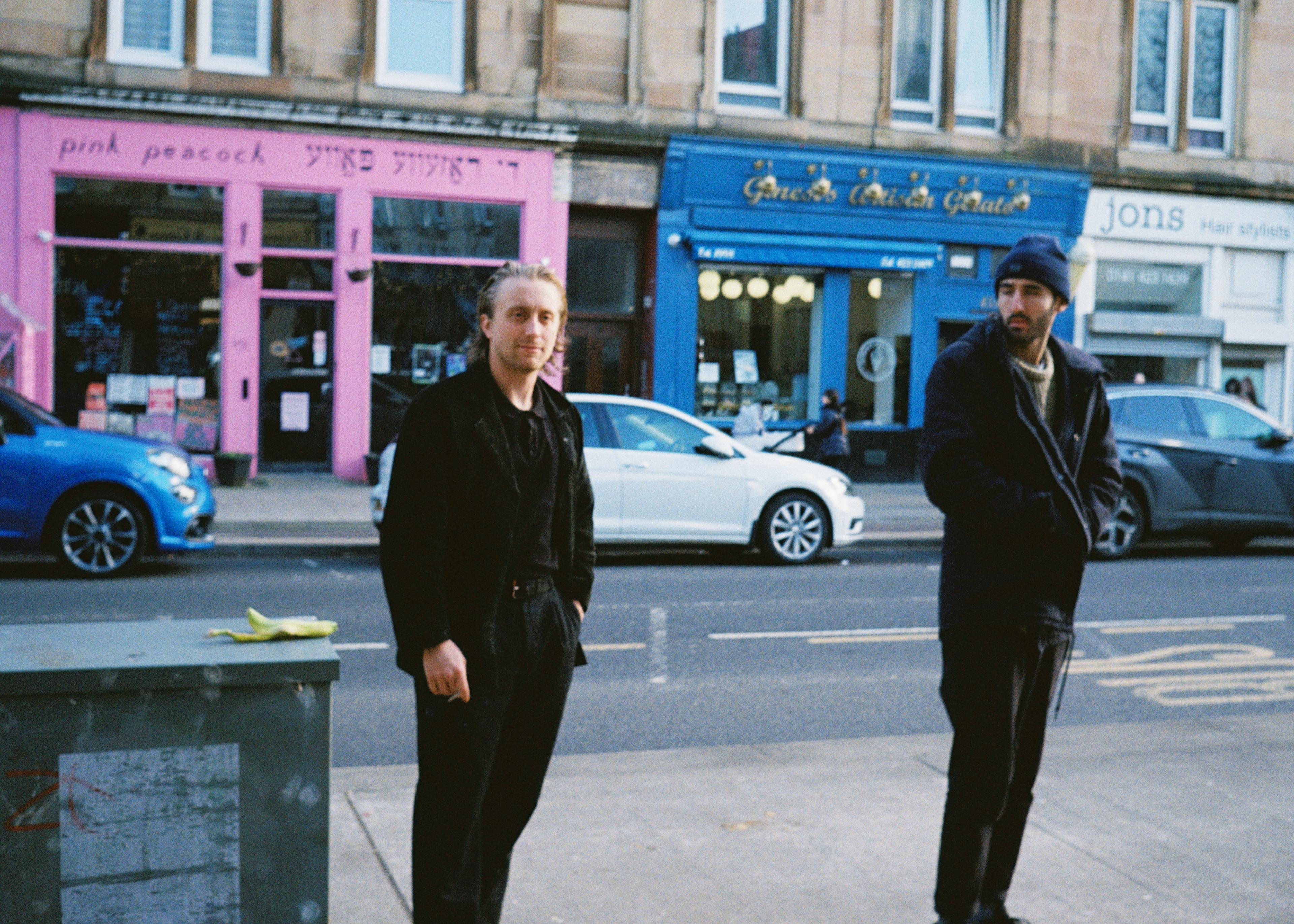 Two men on the sidewalk
