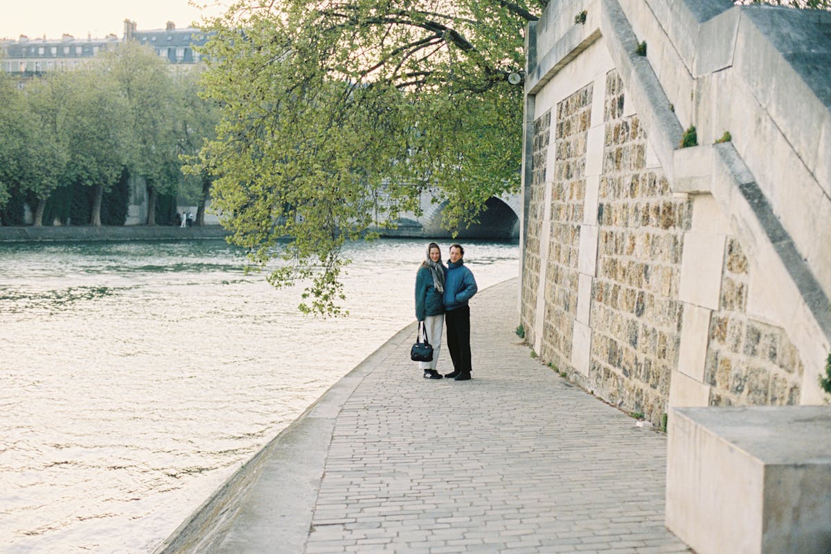 Will and Anna standing on the bank of the Seine